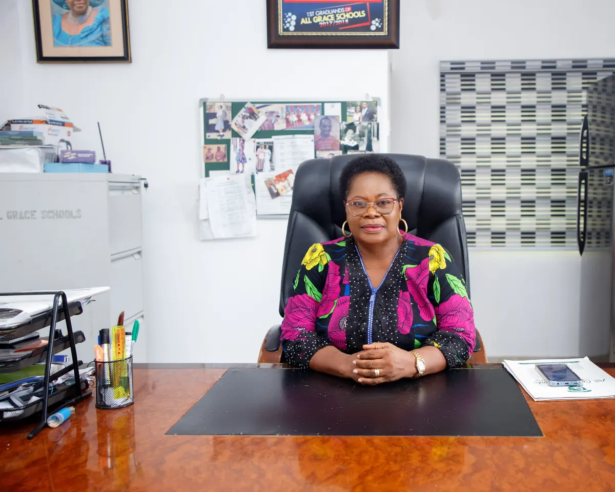 Mrs. B. B. Eshiet, Proprietor, seated at her desk